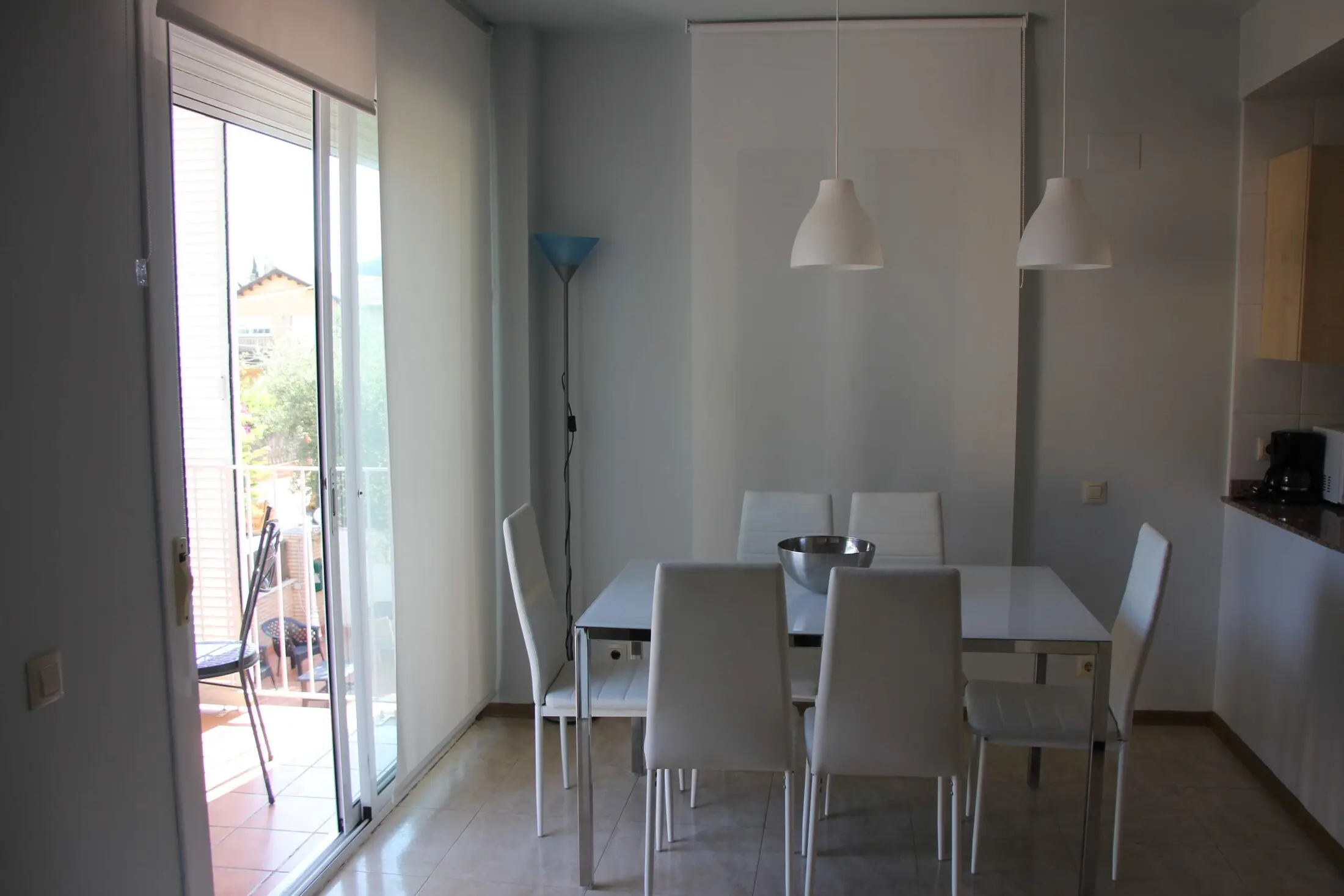 Living-dining room of the 2-bedroom apartment with pool views